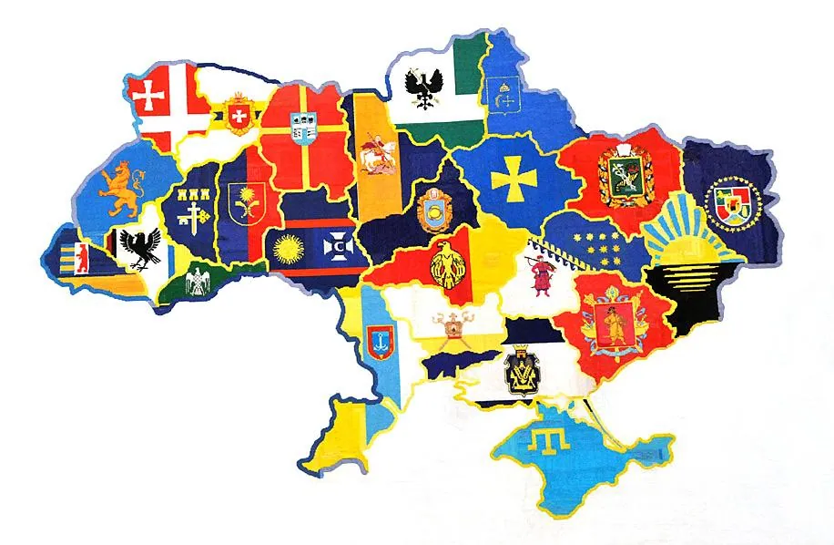 Контурна карта України, кожна область заповнена своїм гербом/прапором; Крим позначено кримськотатарською символікою…